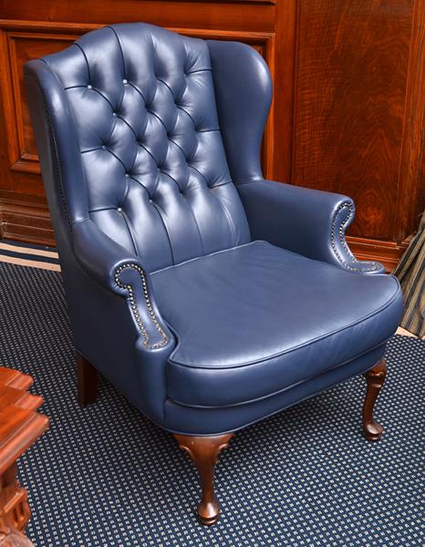 Appraisal: LEATHER UPHOLSTERED BUTTON BACK WING ARMED CHAIR