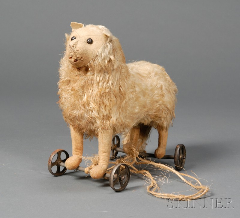 Appraisal: Early Steiff Blonde Mohair Dog on Wheels c black shoe