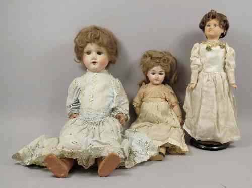 Appraisal: A French bisque headed costume doll with blue eyes and