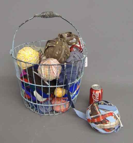 Appraisal: Lot including early wire basket with old fabric balls