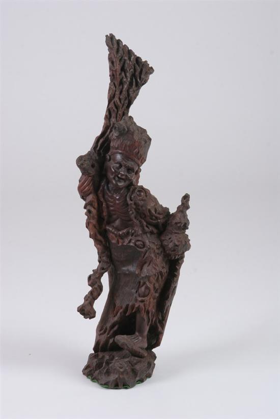 Appraisal: CHINESE WOOD FIGURE OF AN IMMORTAL Holding a staff -