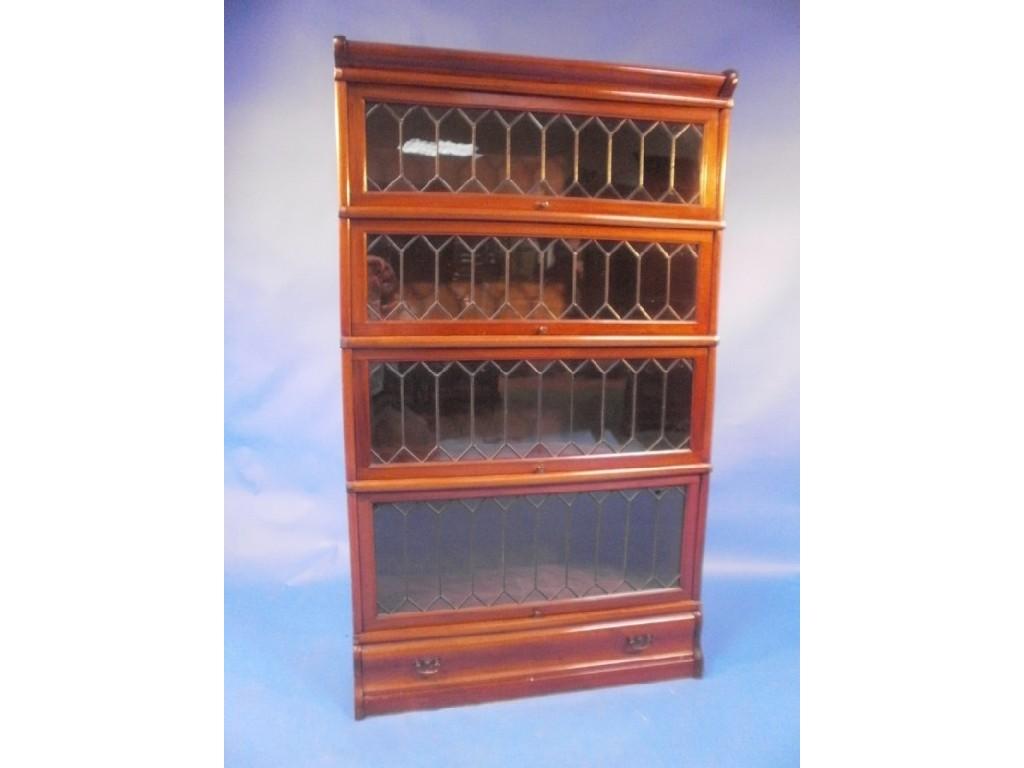 Appraisal: An early thC mahogany Globe Wernicke style bookcase having four