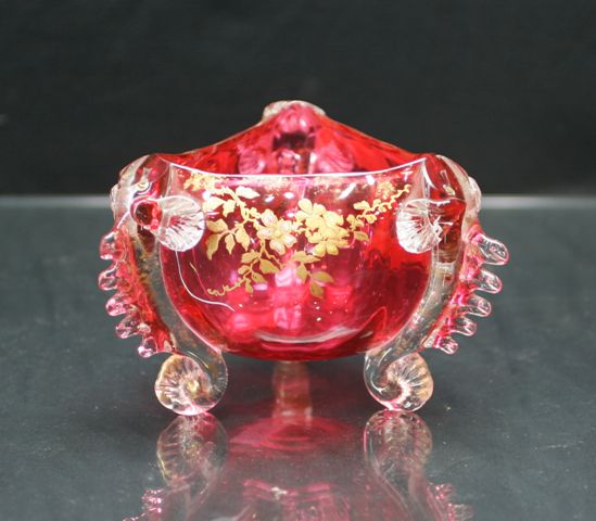 Appraisal: Victorian tricorner footed bowl in ruby glass with clear frilled