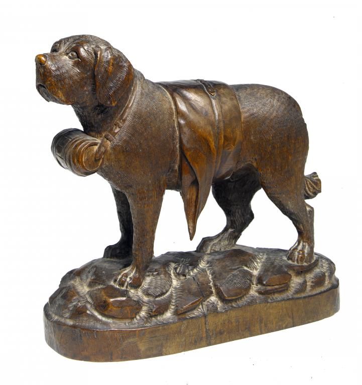 Appraisal: A SWISS LIMEWOOD CARVING OF A ST BERNARD DOG on