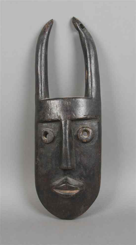 Appraisal: A Carved Wood Mask Toma depicting a horned figure Height