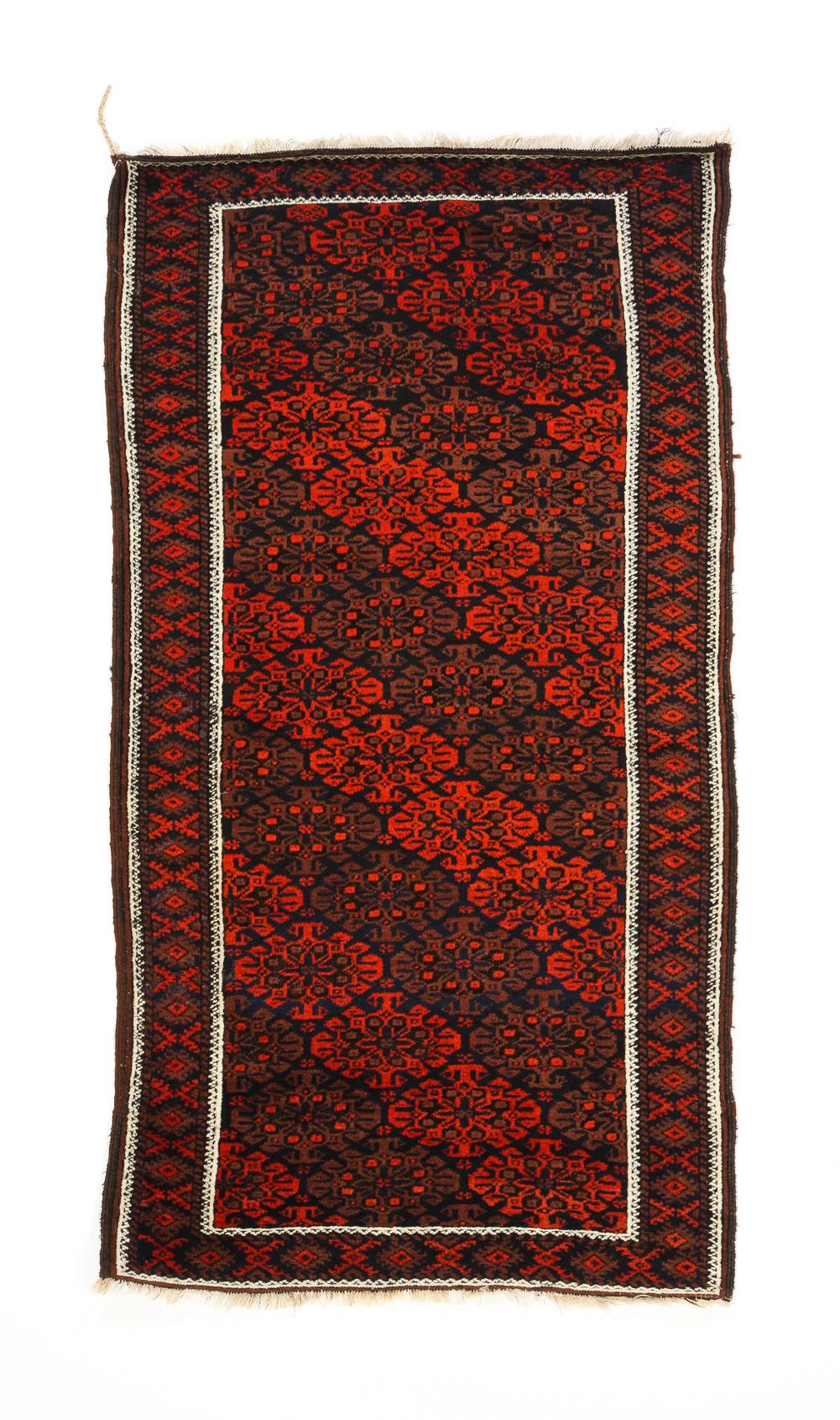 Appraisal: PERSIAN BALUCH RUG Ca All-over diagonal medallions with good oxidation