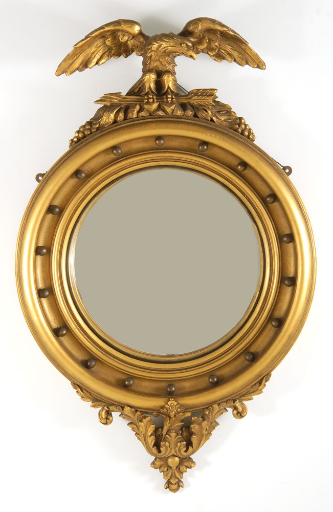 Appraisal: REPRODUCTION GILT CONVEX CONSTITUTION MIRROR WIth spread-wing eagle pediment Foliate