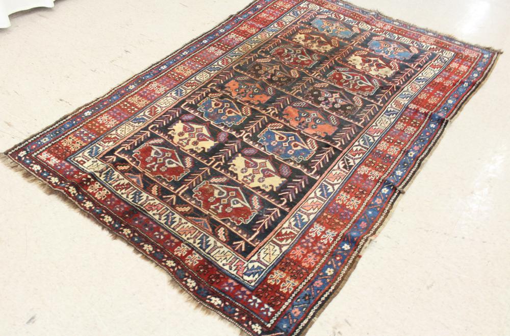 Appraisal: SEMI-ANTIQUE PERSIAN TRIBAL AREA RUG featuring two centralize columns of