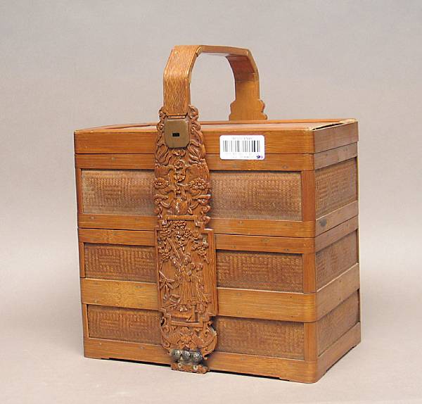 Appraisal: A bamboo gift basket The three-layered basket with criss-crossed bamboo