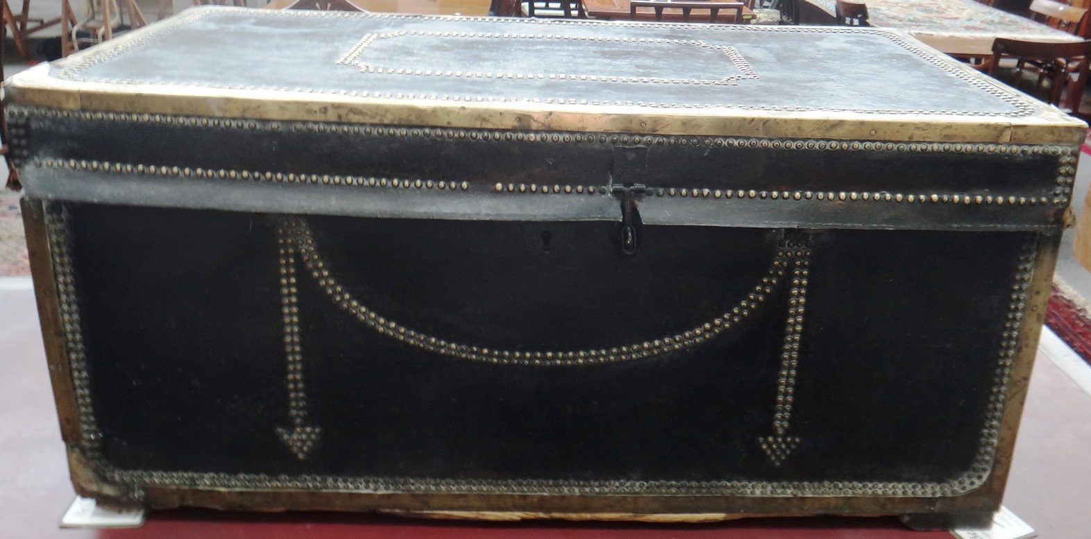 Appraisal: A th century Chinese brass studded leather veneered camphorwood trunk