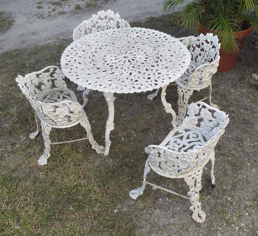 Appraisal: SET OF CAST IRON GRAPE DESIGN CAST IRON CHAIRS Sold