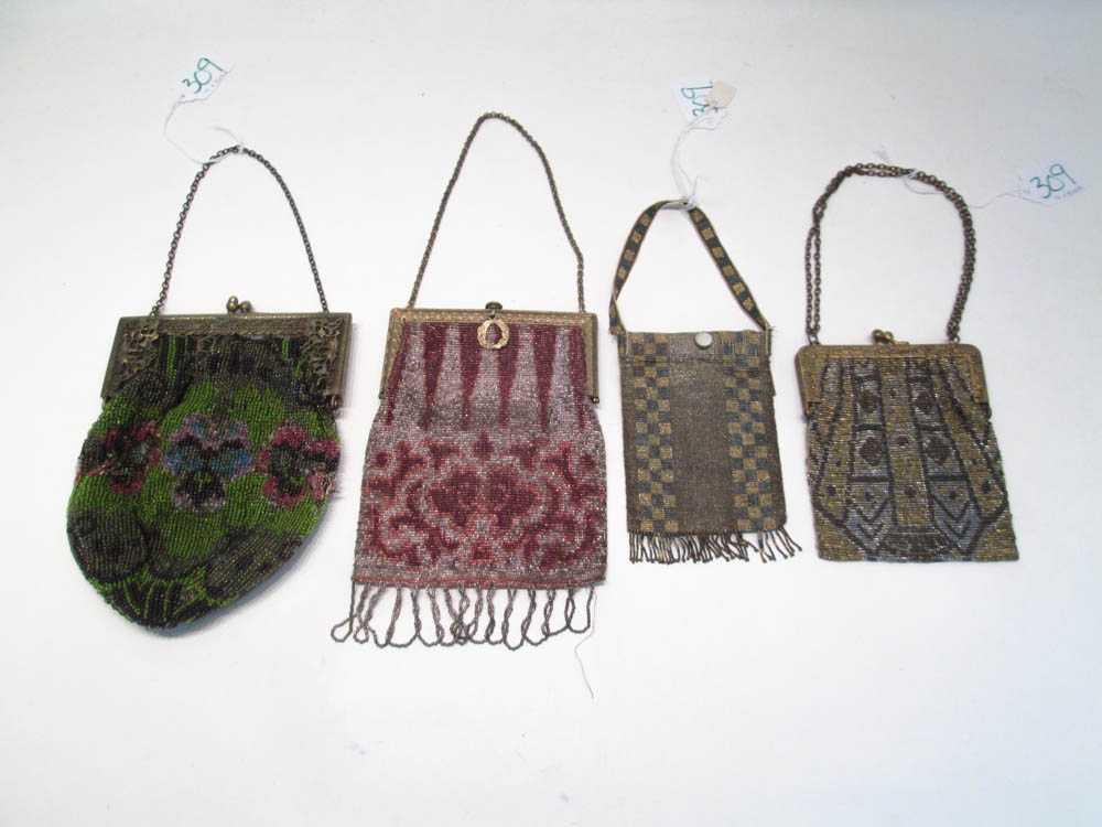 Appraisal: FOUR VICTORIAN BEADED PURSES having floral and geometric designs accented