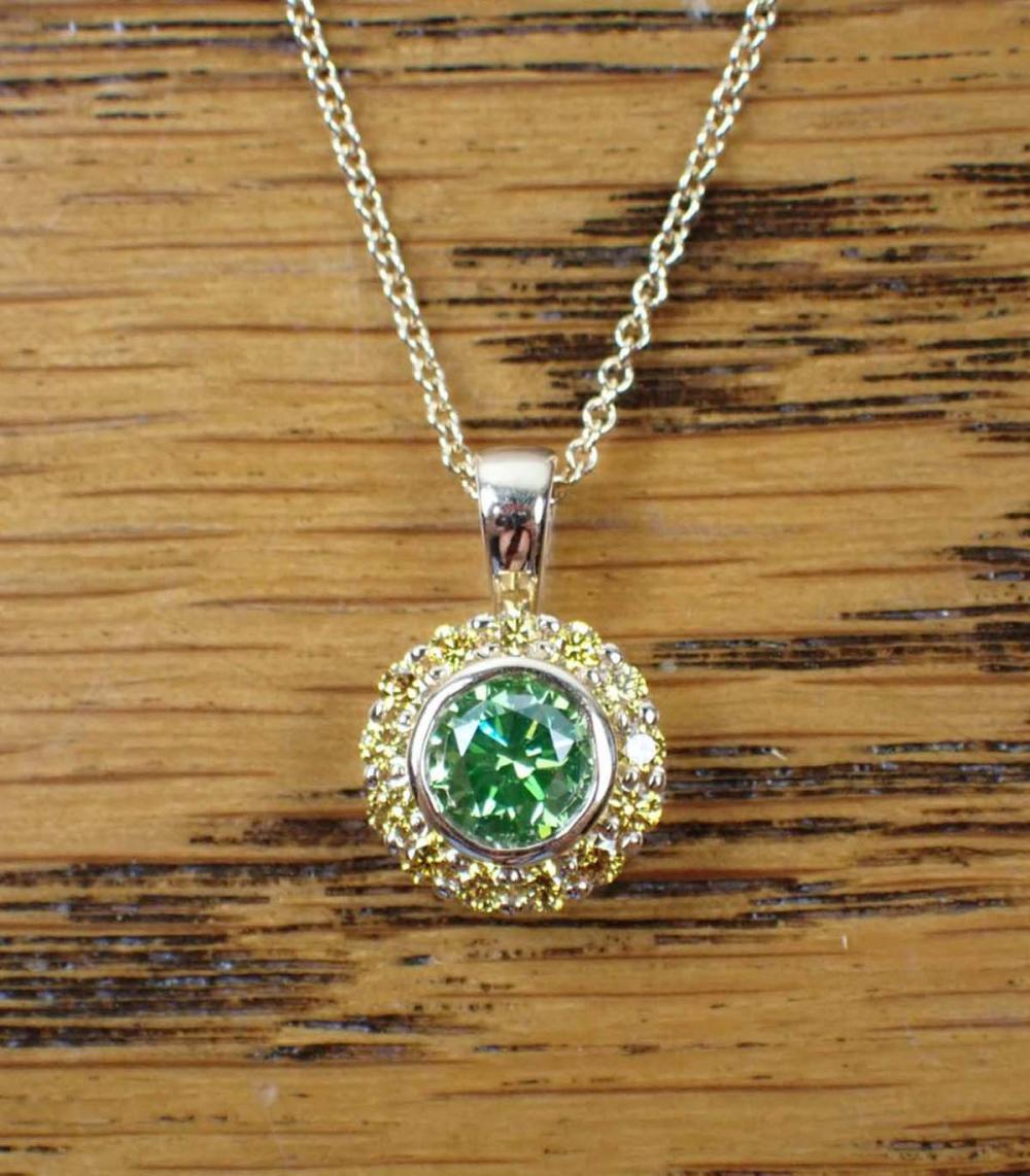 Appraisal: FANCY COLOR DIAMOND PENDANT NECKLACE K yellow gold pendant and