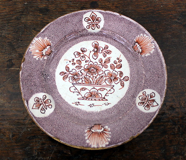 Appraisal: AN TH CENTURY DELFT PLATE with powered manganese ground central