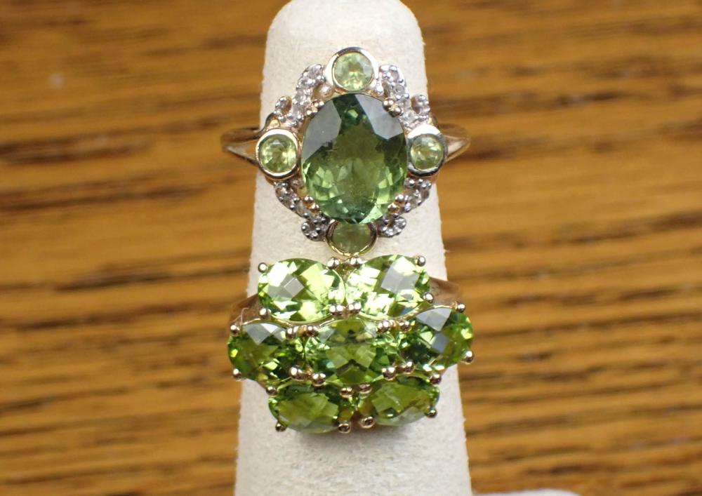 Appraisal: TWO PERIDOT AND YELLOW GOLD RINGS including a k yellow