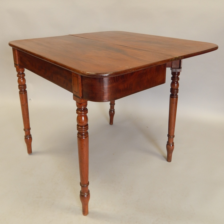 Appraisal: An early thC mahogany tea table the rectangular top with