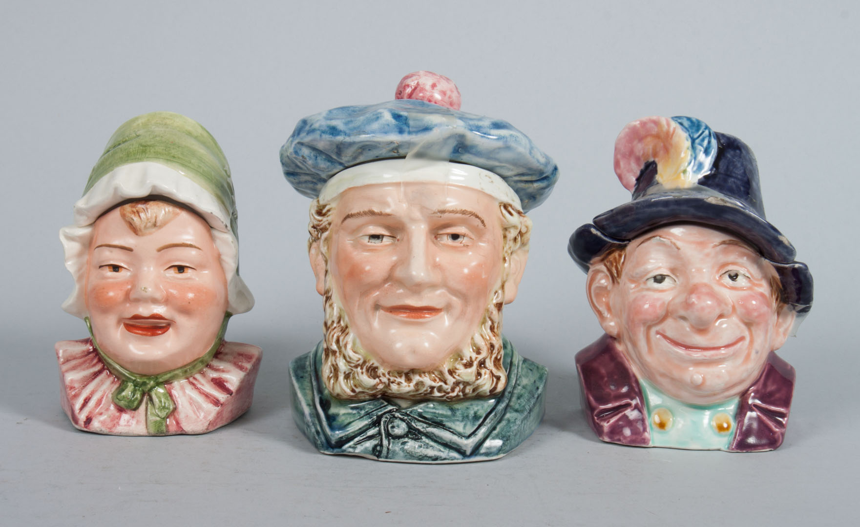 Appraisal: Three German ceramic character tobacco jars early th century including