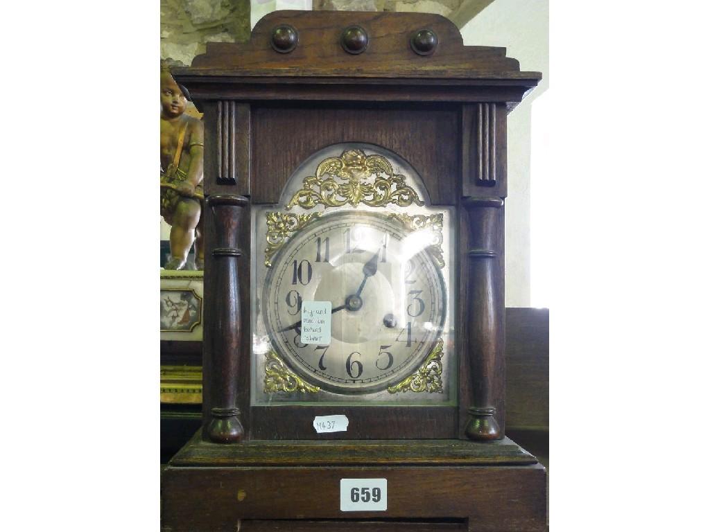 Appraisal: A 's mantle clock with broken arched dial and eight