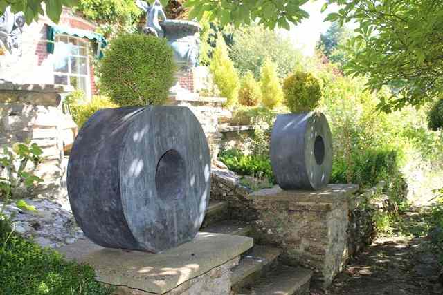 Appraisal: A PAIR OF LEAD DOUGHNUT SHAPED PLANTERS each approximately diameter