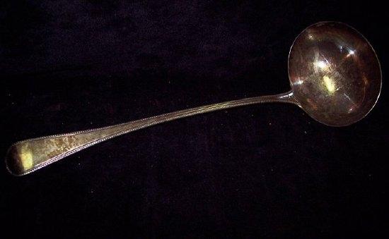 Appraisal: A George III old English pattern ladle with thread borders