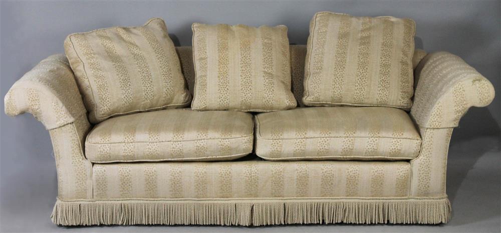 Appraisal: CONTEMPORARY CREAM SOFA WITH BULLION TRIM with rolled arms upholstered