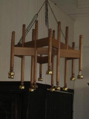 Appraisal: AN OAK TEN LIGHT CHANDELIER late th century the triangular