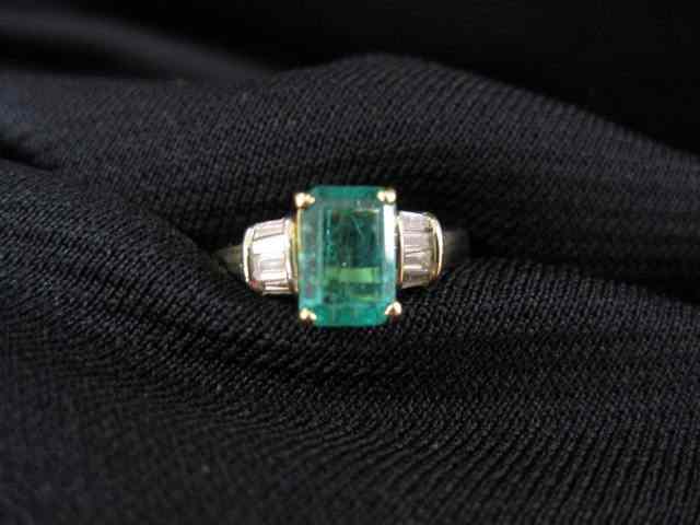 Appraisal: Emerald Diamond Ring rectangular emerald weighing carats with baguette diamonds