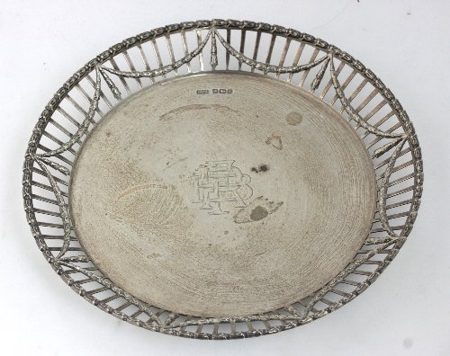 Appraisal: A circular silver dish Sheffield with pierced border and central