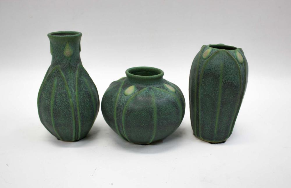 Appraisal: THREE ART POTTERY VASES matching flower and leaf design unsigned