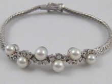 Appraisal: An carat white gold bracelet set with pearls and diamonds