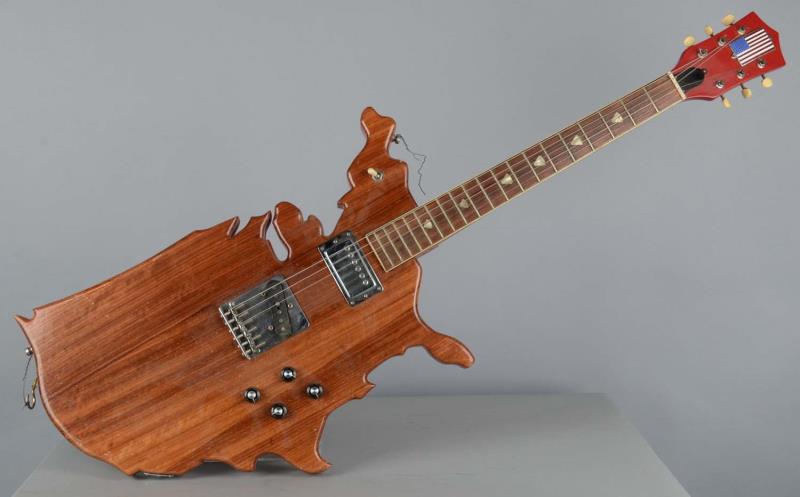 Appraisal: Figural United States Electric Guitar This unique string guitar has