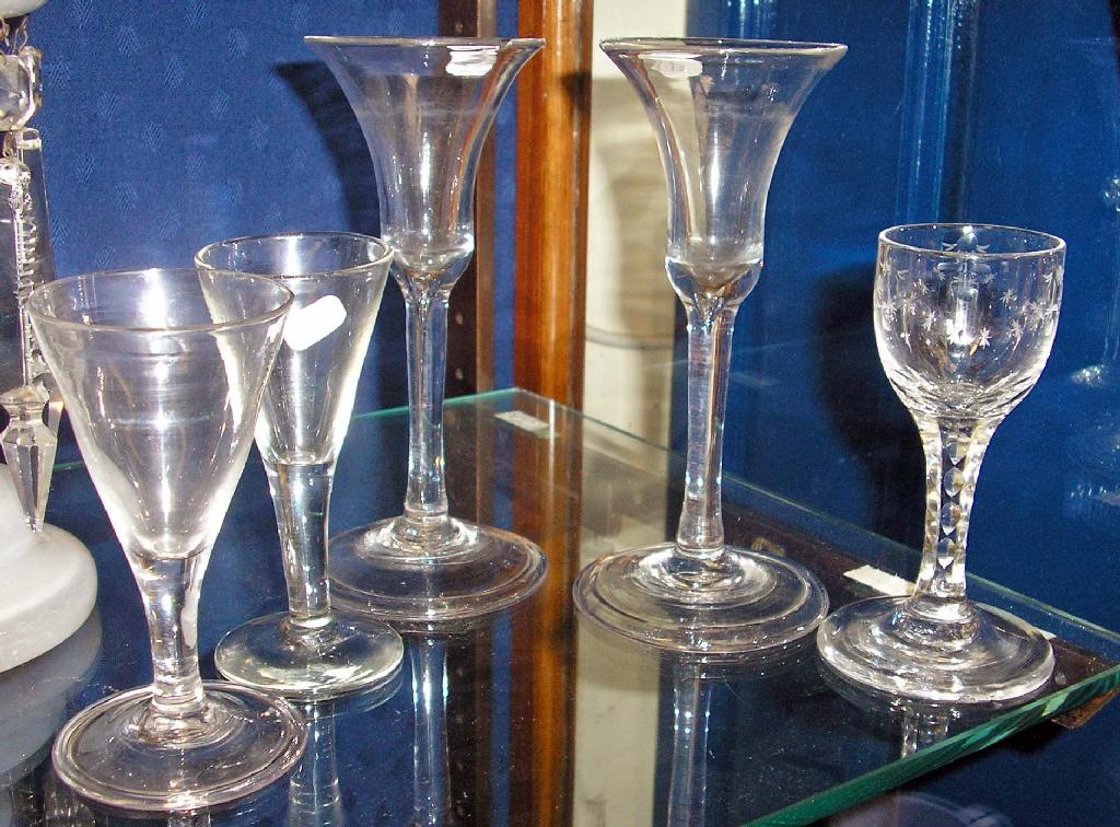 Appraisal: A pair of th century wine glasses with clear stems