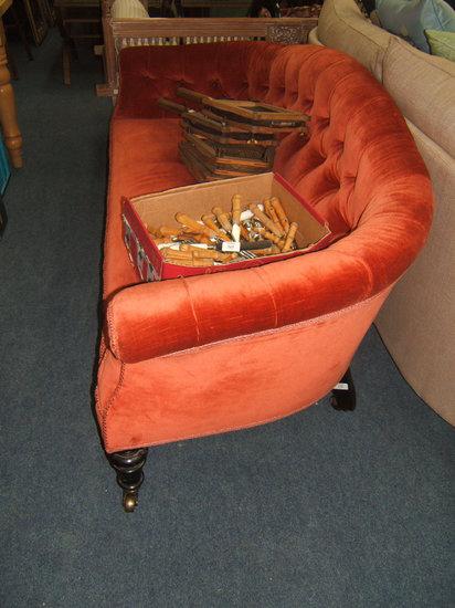 Appraisal: A Victorian red upholstered button back settee indistinctly stamped Taylor