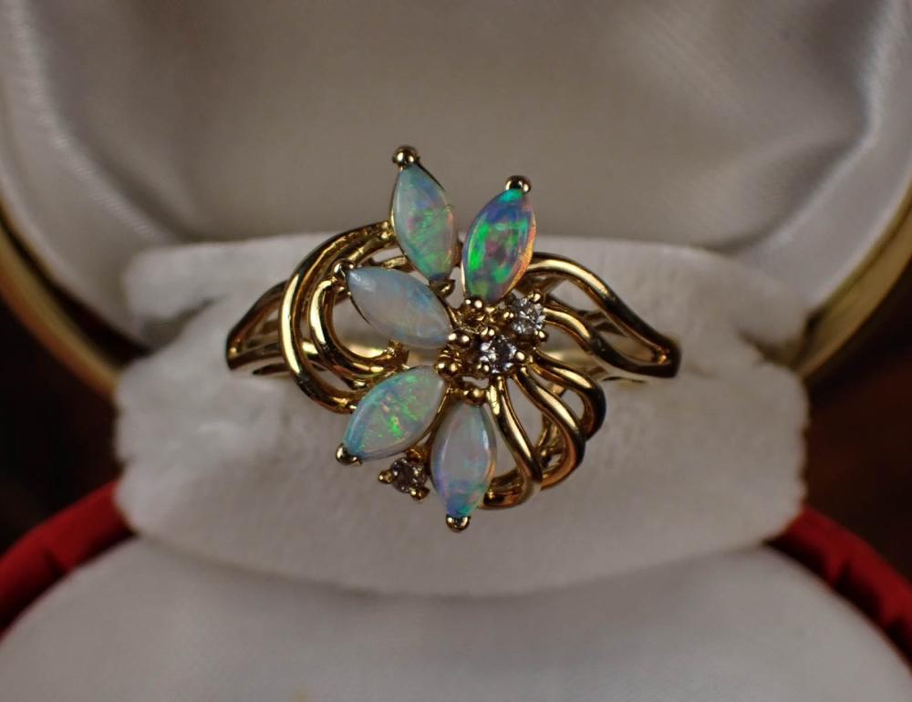 Appraisal: OPAL DIAMOND AND FOURTEEN KARAT GOLD RING set with five