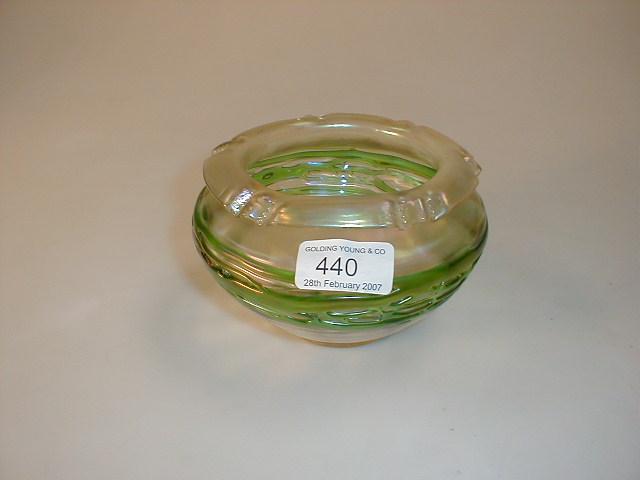 Appraisal: A Loetz style bowl iridescent with green trail work folded