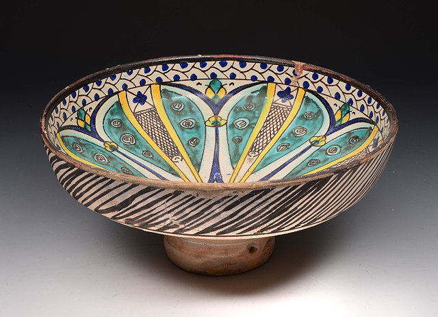 Appraisal: A TH CENTURY MOROCCAN CIRCULAR BOWL on tapering foot with