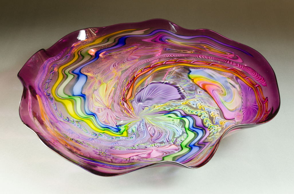 Appraisal: JAMES NOWAK ART GLASS BOWL free-form with swirling colorful cane