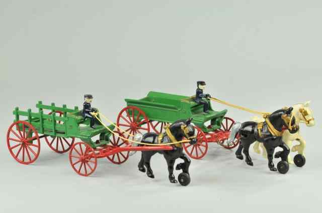 Appraisal: KENTON DRAY STAKE WAGON Both cast iron painted green wagons