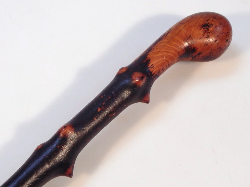 Appraisal: A rustic Blackthorn walking stick rubber foot and polished wood