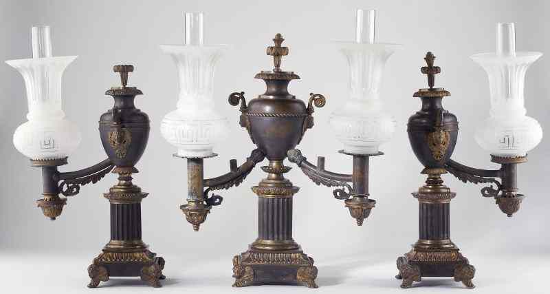 Appraisal: French Argand Lamp Garniture Set circa patinated and gilt bronze