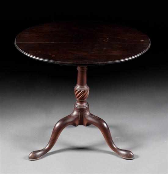 Appraisal: George III mahogany tilt-top tea table circa vase carved center