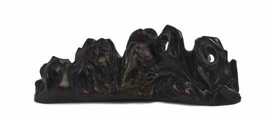 Appraisal: A Carved Wood Brushrest depicting a naturalistic mountain form with