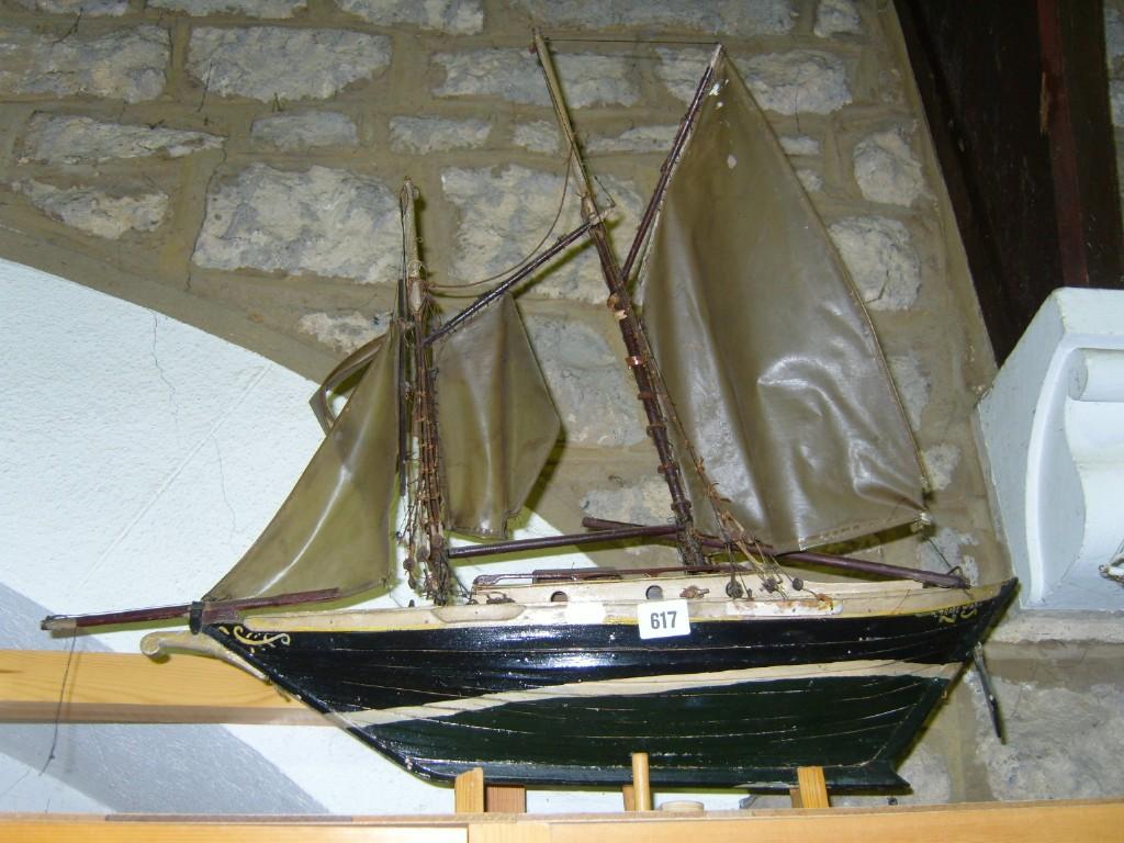 Appraisal: A painted wooden model of a -mast sailing ship Trade