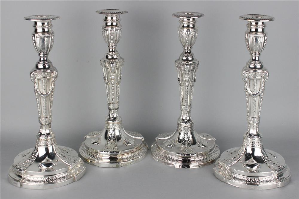 Appraisal: FOUR ENGLISH WEIGHTED SILVER CANDLESTICKS Birmingham maker's marks for Ellis