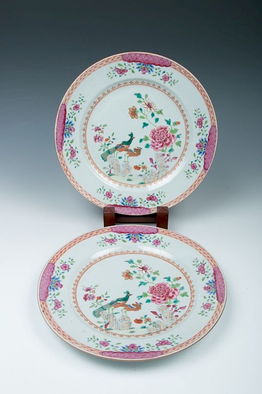 Appraisal: A PAIR OF FAMILLE ROSE PEACOCK PLATES Each plate decorated