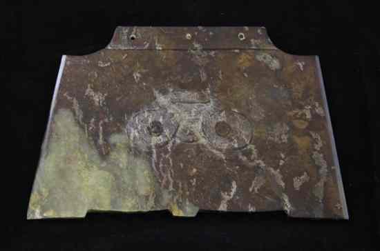 Appraisal: A Chinese green and brown jade ornamental axe head possibly