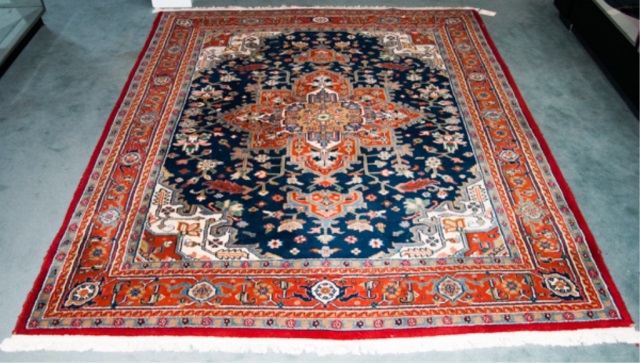 Appraisal: Oriental Style Area Rug Floral design with multiple borders brick