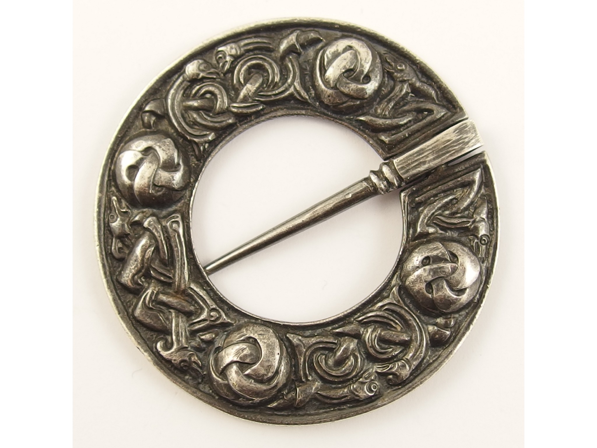 Appraisal: An Alexander Ritchie broochof annular shape with zoomorphic knotwork creatures