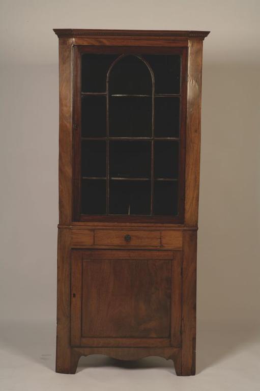 Appraisal: A GEORGE III MAHOGANY CORNER CUPBOARD with a dentil moulded