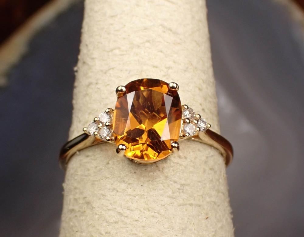 Appraisal: CITRINE DIAMOND AND FOURTEEN KARAT GOLD RING The yellow gold